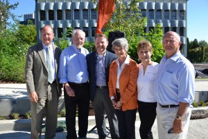 TriMet General Manager Neil McFarlane, State Sen. Rod Monroe, OHSU's Brian Newman, Metro Councilor Carlotta Collette, State Rep. Carolyn Tomei and Clackamas County Commissioner Jim Bernard celebrate the 50% completion milestone for the Portland-Milwaukie Light Rail Transit Project.