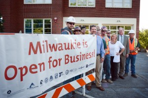 Milwaukie Mayor Jeremy Ferguson; TriMet General Manager, Neil McFarlane and Greg "Frank" Hemer from Milwaukie Lumber announce that Milwaukie is open for business in a press conference outside Milwaukie City Hall Monday 8/19/13. © 2013 TriMet / Fred Joe