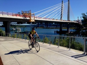 A cyclist enjoys the new Eastside Greenway Trail on June 30, 2014 during the first hours of the unofficial re-opening.