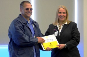 Bus Operator Robert Boos is inducted into the Million Mile Club for safe driving. Transportation Executive Director Shelly Lomax congratulates him and notes that it takes a minimum of 29 years to reach this milestone
