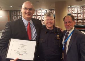 Former Transit Police Commander and now Assistant Chief Mike Leloff was honored for his service by the TriMet board of directors on Wed., August 10. New Transit Police Commander Sara Westbrook was introduced to the board. (Left to right: Leloff, Westbrook and TriMet Executive Director of Safety & Security Harry Saporta)
