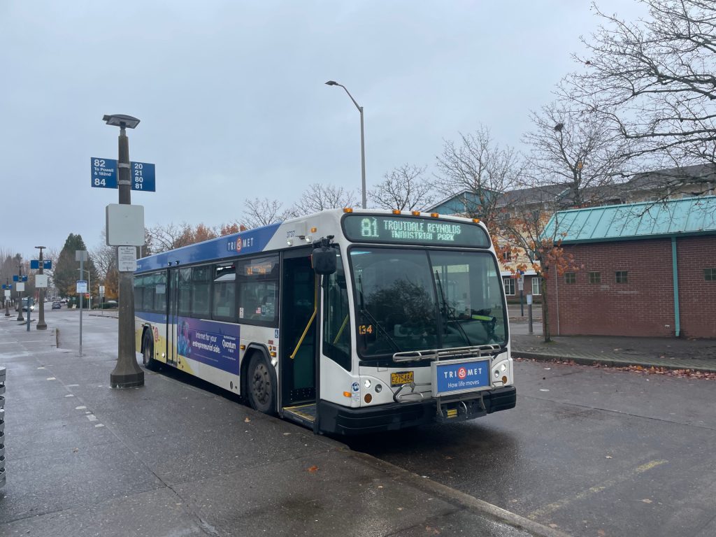 Image of a TriMet Line 81 bus at Gresham Central Transit Central, displaying the header destination Troutdale Reynolds Industrial Park.