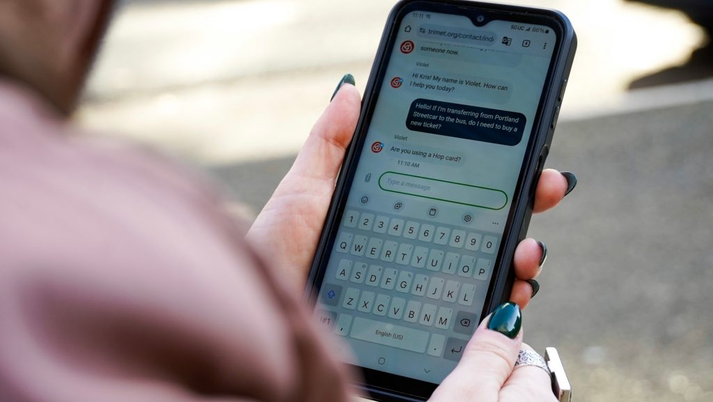 Image of a smartphone displaying TriMet customer support chat.