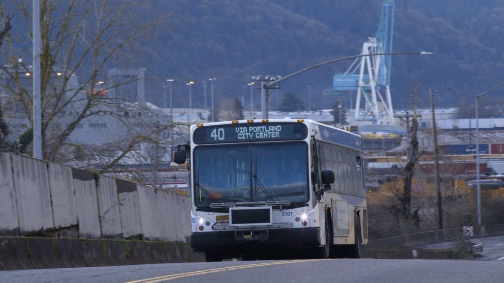 Image of a Line 40 bus with the header "Via Portland City Center" and Portland's docks in the background.