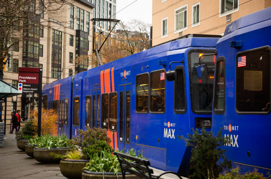 Image of a MAX Red Line train at the Providence Park MAX Station.